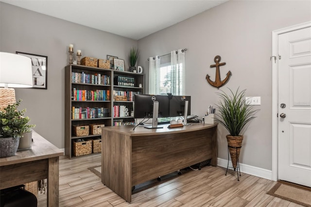 home office featuring light hardwood / wood-style floors