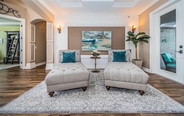 living area featuring ornamental molding and dark hardwood / wood-style floors