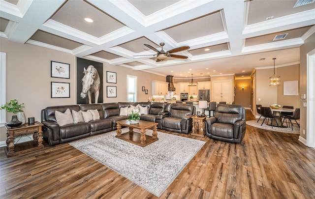 living room with ornamental molding, ceiling fan, coffered ceiling, and hardwood / wood-style floors