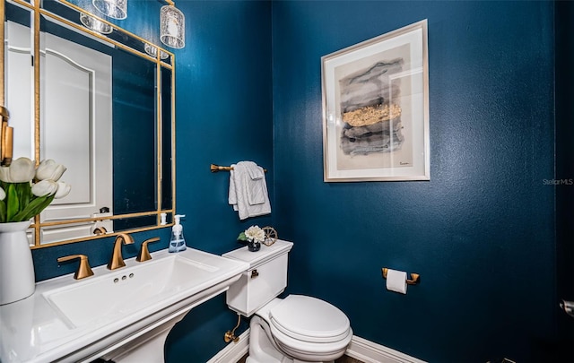 bathroom with toilet and sink