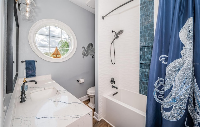 full bathroom featuring wood-type flooring, vanity, toilet, and shower / bath combo