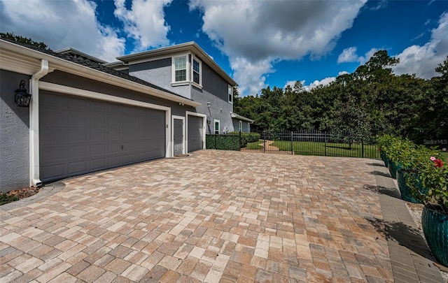 view of side of property featuring a garage