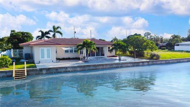 view of swimming pool featuring a patio and french doors