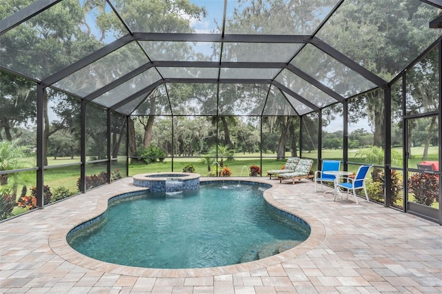 view of swimming pool with a lanai, a yard, an in ground hot tub, and a patio area