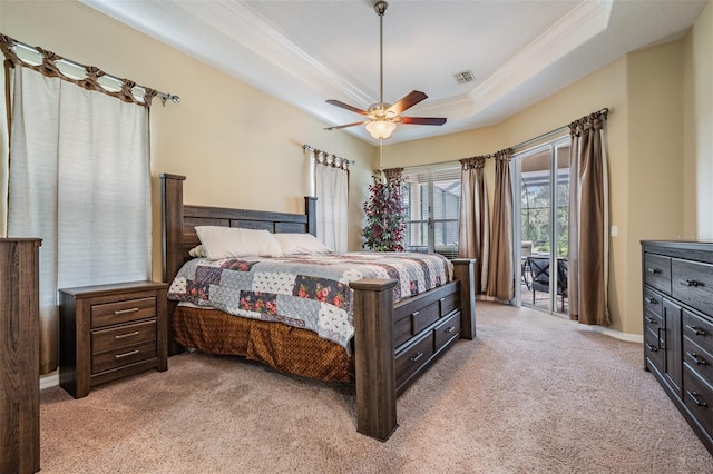 bedroom featuring light colored carpet, a raised ceiling, access to exterior, ceiling fan, and visible vents