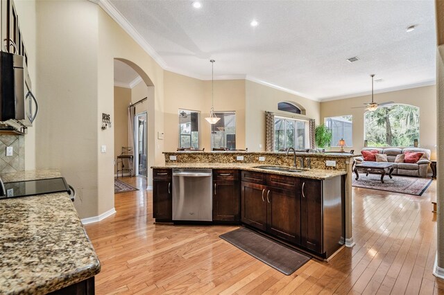 kitchen featuring pendant lighting, light wood-type flooring, sink, stainless steel appliances, and ceiling fan