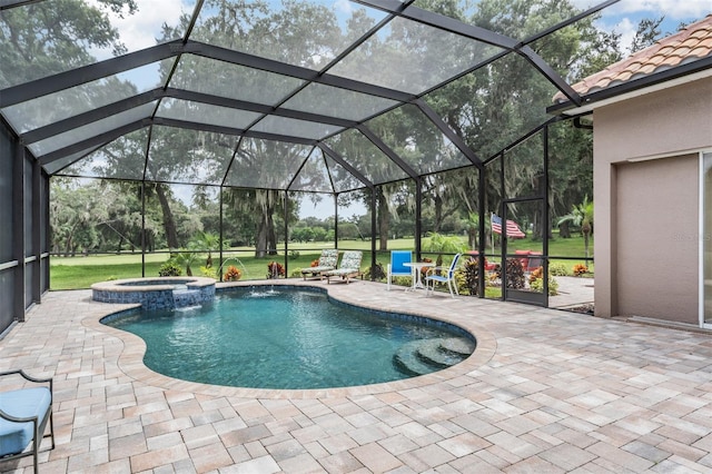 view of pool with a lanai, a patio, and an in ground hot tub