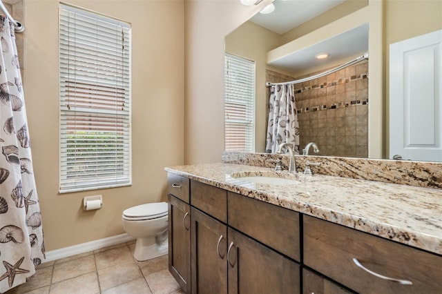 bathroom with toilet, vanity, a shower with curtain, tile patterned flooring, and baseboards