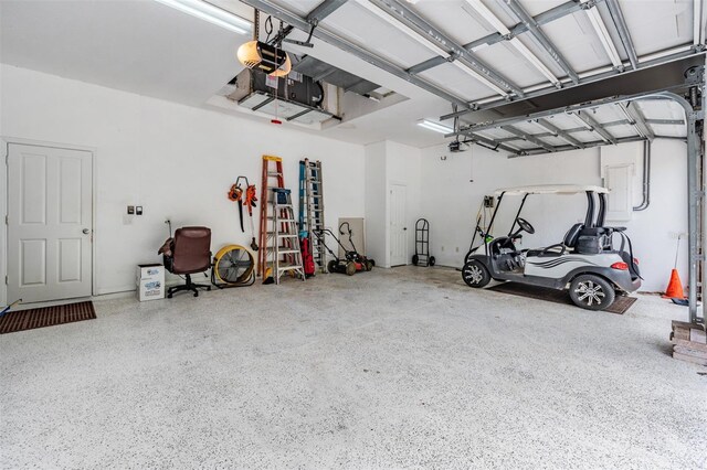 garage featuring a garage door opener