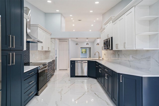 kitchen with kitchen peninsula, wall chimney exhaust hood, appliances with stainless steel finishes, tasteful backsplash, and white cabinetry