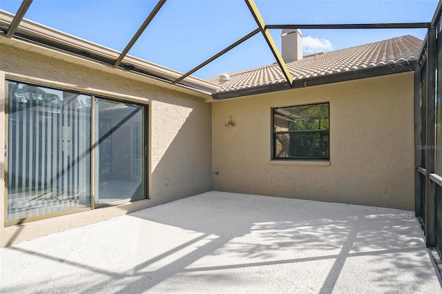 view of patio with a lanai