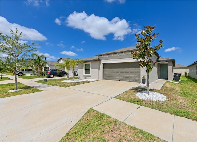 view of front of property featuring a garage and a front lawn