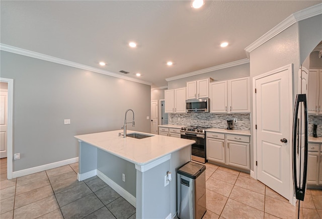 kitchen with white cabinetry, a kitchen island with sink, stainless steel appliances, ornamental molding, and sink