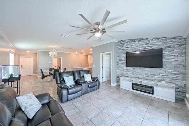 tiled living room featuring ceiling fan with notable chandelier, vaulted ceiling, ornamental molding, and sink