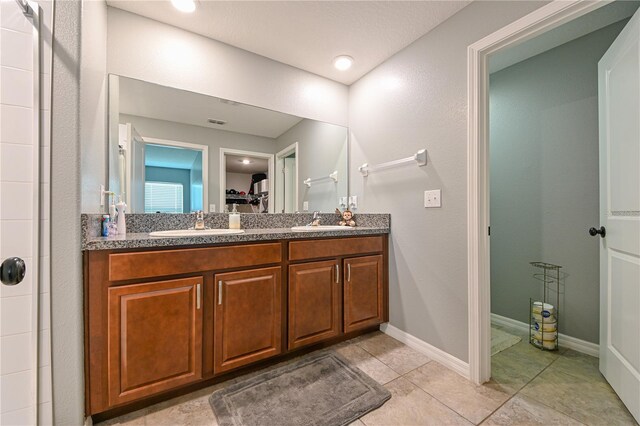 bathroom with vanity and tile patterned floors