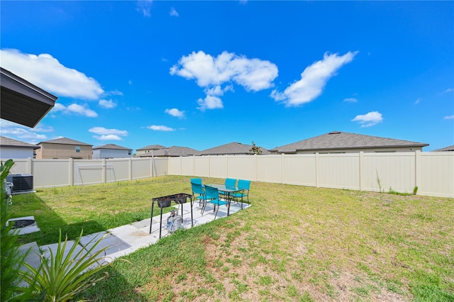 view of yard featuring cooling unit and a patio area