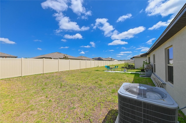 view of yard with central AC