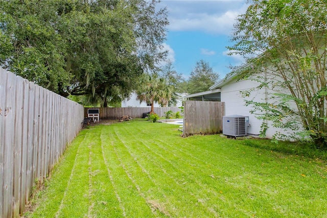 view of yard featuring central AC