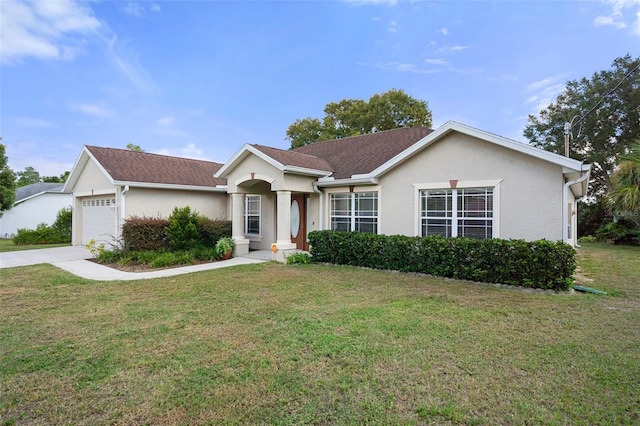 ranch-style home with a front lawn and a garage