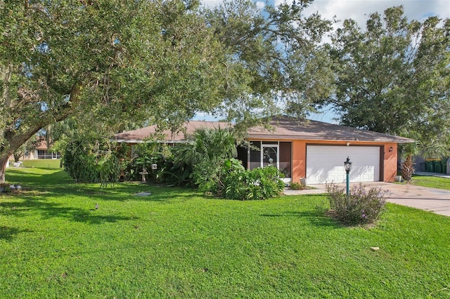 view of front of home with a front lawn and a garage