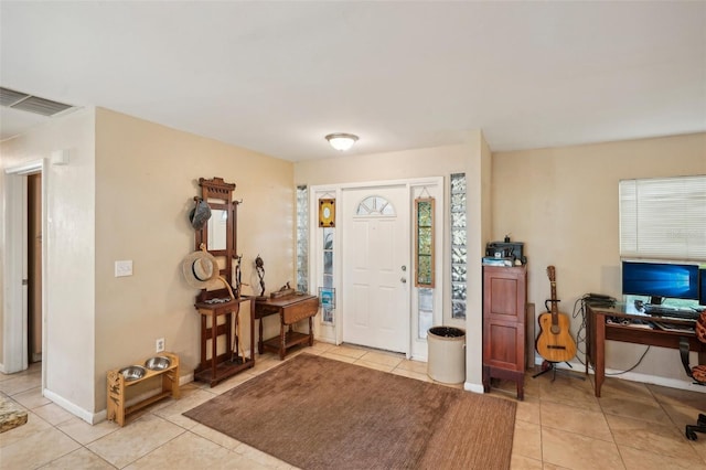 entrance foyer featuring light tile patterned floors