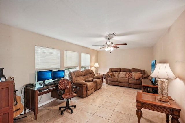 living room featuring light tile patterned floors and ceiling fan