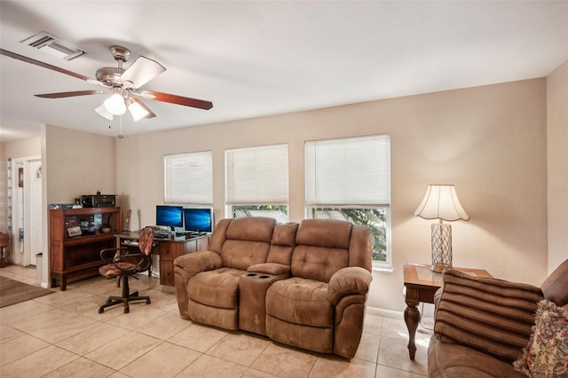 living room with ceiling fan and light tile patterned floors