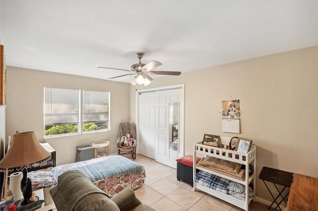 tiled living room with ceiling fan