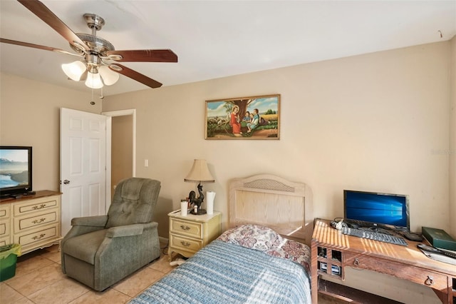 tiled bedroom featuring ceiling fan