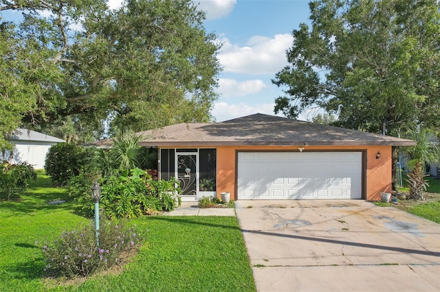 single story home with a front yard and a garage