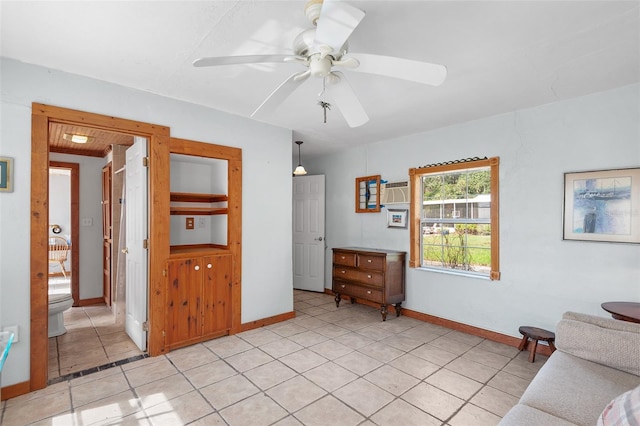 unfurnished room with ceiling fan and light tile patterned floors