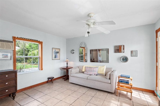 tiled living room featuring ceiling fan