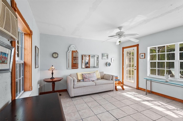 living room with ceiling fan and light tile patterned floors