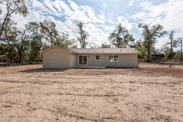 rear view of property featuring a patio area