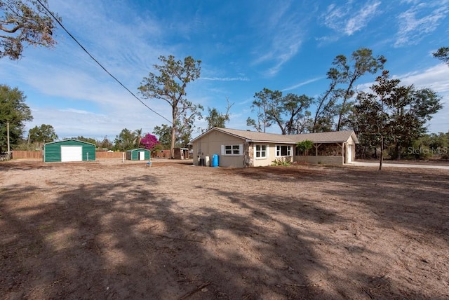 view of home's exterior with an outdoor structure and a garage