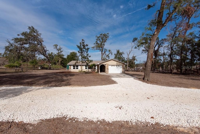 single story home featuring a garage