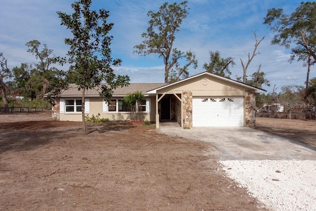 ranch-style house featuring a garage