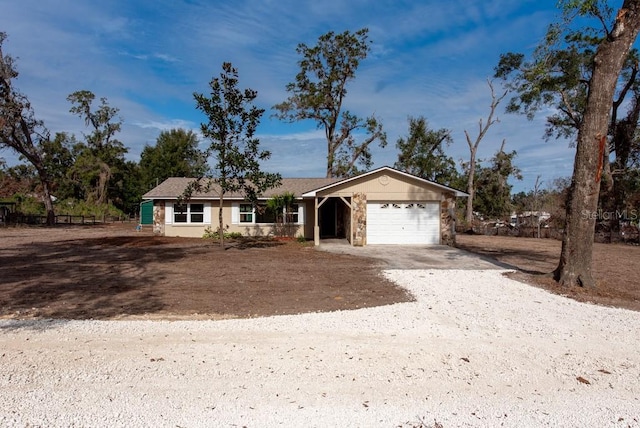 ranch-style home featuring a garage