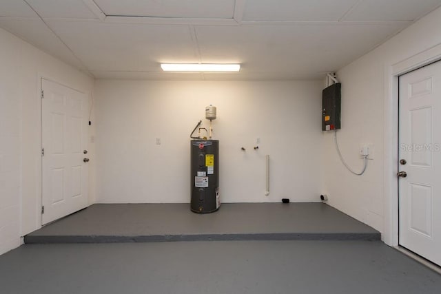 garage with electric panel and electric water heater