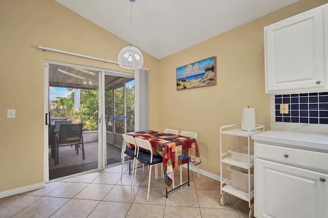 1122 Vinetree Dr, Brandon, FL 33510 - dining space with baseboards, lofted ceiling, and light tile patterned floors