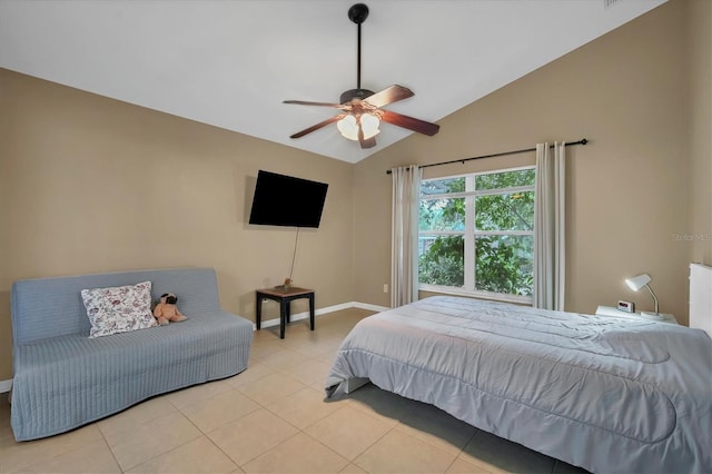 bedroom with ceiling fan, lofted ceiling, and light tile patterned floors