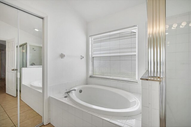 1122 Vinetree Dr, Brandon, FL 33510 - full bath featuring tile patterned flooring, a stall shower, and a bath