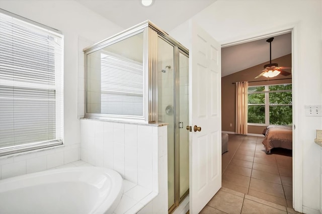 bathroom with lofted ceiling, ceiling fan, tile patterned floors, and separate shower and tub