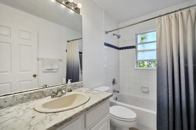 full bathroom with shower / bath combination with curtain, vanity, and toilet