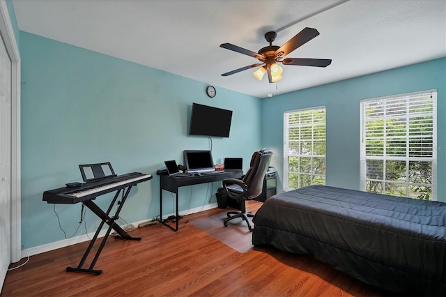 bedroom featuring ceiling fan and hardwood / wood-style floors