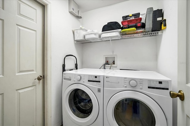 washroom with washing machine and dryer