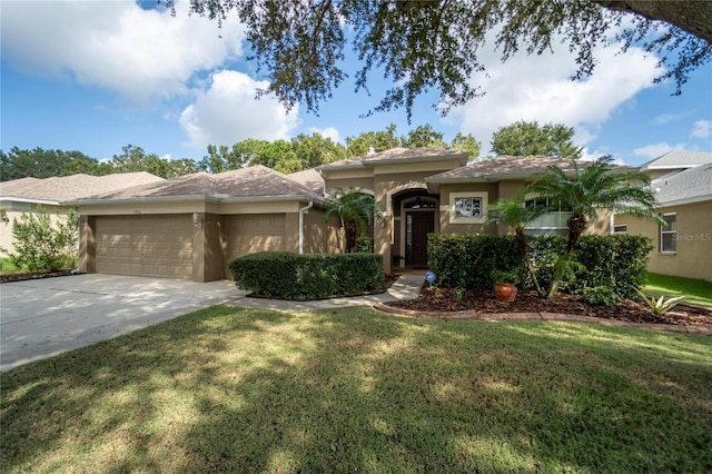 view of front of property featuring a garage and a front lawn