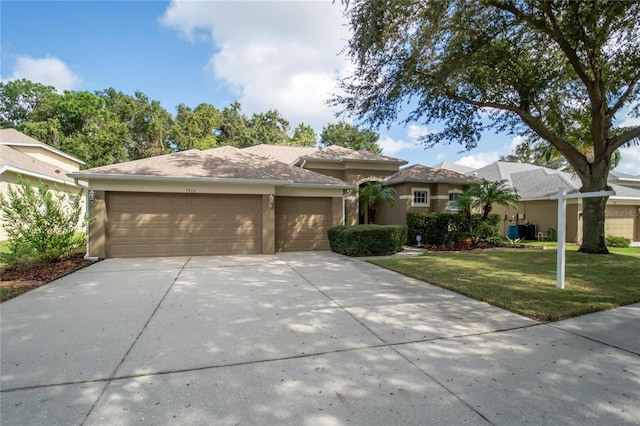 view of front facade featuring a garage and a front lawn