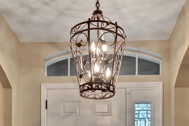 interior details with an inviting chandelier