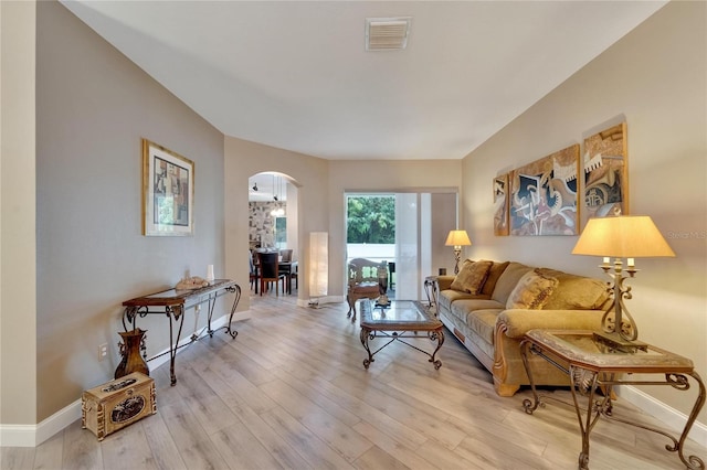 living room with light hardwood / wood-style flooring